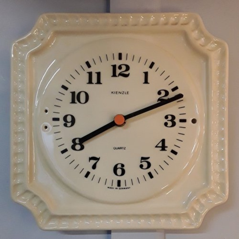 Vintage German Wall Clock in Cream-Colored Ceramics with Black Hands and Digits with Orange Point from Kienzle, 1970s for sale at Pamono