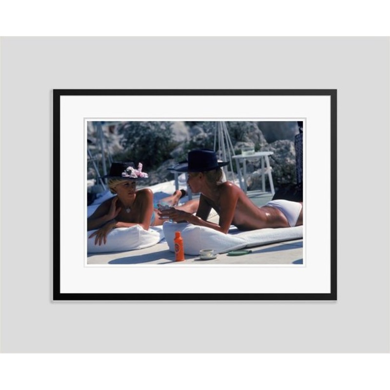 Sunbathing in Antibes Oversize C Print Framed in Black by Slim Aarons for sale at Pamono